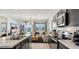 Modern kitchen flows into a light-filled living area, offering a seamless, stylish space at 35556 N Common Ct, San Tan Valley, AZ 85140