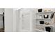 Clean, bright shower with built-in shelving and stylish curtain, complemented by neatly organized shelves at 35556 N Common Ct, San Tan Valley, AZ 85140