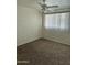 A bedroom featuring a ceiling fan, brick accent wall, carpet and a window with blinds at 3608 W Hazelwood St, Phoenix, AZ 85019