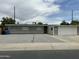 Charming single-story home with a well-kept gravel front yard and attached two-car garage at 3608 W Hazelwood St, Phoenix, AZ 85019