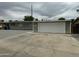 Side view of a single story house with a long driveway to a two-car garage at 3608 W Hazelwood St, Phoenix, AZ 85019