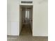 Hallway with tile flooring providing access to multiple rooms in the house at 3608 W Hazelwood St, Phoenix, AZ 85019
