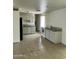 Functional kitchen with white appliances, light cabinets, and neutral countertops at 3608 W Hazelwood St, Phoenix, AZ 85019