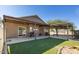 Charming back patio offers a covered area, artificial turf, and access to the backyard at 3720 E Vista Grande --, San Tan Valley, AZ 85140