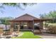 Charming backyard features a fire pit, a covered patio and artificial turf at 3720 E Vista Grande --, San Tan Valley, AZ 85140