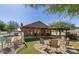 Relaxing backyard featuring a fire pit, covered patio, artificial turf, and pool at 3720 E Vista Grande --, San Tan Valley, AZ 85140