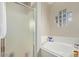 A bathroom showcasing a tub and glass enclosed shower, with decorative glass block at 3720 E Vista Grande --, San Tan Valley, AZ 85140