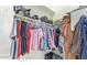 Walk-in closet with clothing and storage items on shelves and hanging on rods at 3720 E Vista Grande --, San Tan Valley, AZ 85140