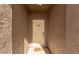 Front entryway with a light-colored door and southwestern themed decor, creating a welcoming entrance at 3720 E Vista Grande --, San Tan Valley, AZ 85140
