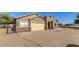 Neutral colored home with desert landscaping, and a spacious driveway leading to an attached two-car garage at 3720 E Vista Grande --, San Tan Valley, AZ 85140
