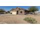 Exterior view of a single-story home showcasing the side yard, garage, desert landscaping, and horse property at 3720 E Vista Grande --, San Tan Valley, AZ 85140