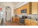 Modern kitchen featuring stainless steel appliances, granite countertops, and ample cabinet space at 3720 E Vista Grande --, San Tan Valley, AZ 85140