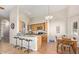 Eat-in kitchen featuring granite countertops, stainless appliances, and breakfast bar seating at 3720 E Vista Grande --, San Tan Valley, AZ 85140