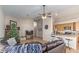 Open-concept living area with a brick fireplace, comfortable seating, and seamless flow to the kitchen at 3720 E Vista Grande --, San Tan Valley, AZ 85140