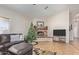 Comfortable living room featuring tile flooring, a cozy brick fireplace, and plenty of natural light at 3720 E Vista Grande --, San Tan Valley, AZ 85140