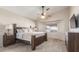 Spacious main bedroom with a ceiling fan, neutral tones, and a large window at 3720 E Vista Grande --, San Tan Valley, AZ 85140