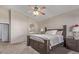 Serene main bedroom featuring neutral carpet, a ceiling fan, and an en-suite bathroom at 3720 E Vista Grande --, San Tan Valley, AZ 85140