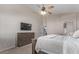 Spacious main bedroom with a ceiling fan, TV on a dresser and a king size bed at 3720 E Vista Grande --, San Tan Valley, AZ 85140