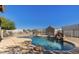 Sparkling in-ground pool area featuring waterfall and ample space for outdoor relaxation at 3720 E Vista Grande --, San Tan Valley, AZ 85140