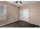 Bedroom featuring wood-look floors, window, and a sliding door closet, maximizing space at 40275 W Art Pl, Maricopa, AZ 85138