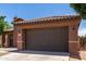 Charming single-story home with a well-maintained front yard, arched entry, and a two car garage at 40275 W Art Pl, Maricopa, AZ 85138