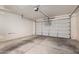Spacious two-car garage providing ample parking and storage space for vehicles and belongings at 40275 W Art Pl, Maricopa, AZ 85138