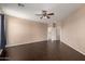 This living room boasts hardwood floors and ample space with adjacent rooms nearby at 40275 W Art Pl, Maricopa, AZ 85138