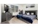 Comfortable bedroom with plush carpeting, dresser, and bright window overlooking the exterior at 40441 W Hillman Dr, Maricopa, AZ 85138