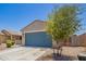 Attractive home featuring a two-car garage, low-maintenance landscaping, and a private front courtyard at 40441 W Hillman Dr, Maricopa, AZ 85138