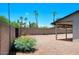 Spacious backyard with desert landscaping, mature trees, and a block fence for privacy at 4079 E Shangri La Rd, Phoenix, AZ 85028