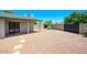 Large backyard area featuring low maintenance gravel landscaping, covered patio, and privacy fence at 4079 E Shangri La Rd, Phoenix, AZ 85028