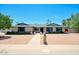 Charming single-story home with a manicured yard and walkway leading to the front door at 4079 E Shangri La Rd, Phoenix, AZ 85028