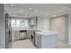 Well-lit kitchen equipped with stainless appliances, white countertops, and ample cabinet space at 4079 E Shangri La Rd, Phoenix, AZ 85028