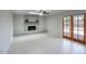 Bright living room with a brick fireplace, wood mantel, and glass patio doors at 4079 E Shangri La Rd, Phoenix, AZ 85028