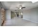 Open-concept living room leading into the kitchen with neutral tones and tile floors at 4079 E Shangri La Rd, Phoenix, AZ 85028