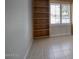 Bright office with a wall of built-in shelving next to a shuttered window at 4079 E Shangri La Rd, Phoenix, AZ 85028