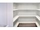 Walk-in pantry with ample shelving for organized storage, ideal for kitchen convenience at 4079 E Shangri La Rd, Phoenix, AZ 85028