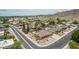 Aerial view of a corner lot house with desert landscaping, a private pool and mountain views in the background at 4229 E Pearce Rd, Phoenix, AZ 85044