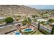 Desert home featuring a fenced pool, covered patio, desert landscaping, and palm trees, set in a quiet neighborhood at 4229 E Pearce Rd, Phoenix, AZ 85044