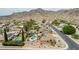 Stunning aerial view showcases a neighborhood featuring desert landscaping and private backyard pools at 4229 E Pearce Rd, Phoenix, AZ 85044