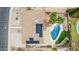 Aerial view of backyard that features a pool, desert landscaping and solar panels on the roof at 4229 E Pearce Rd, Phoenix, AZ 85044
