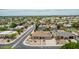 Aerial view features desert landscaping and a private pool in a neighborhood with lush green trees at 4229 E Pearce Rd, Phoenix, AZ 85044