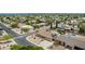 A quiet residential neighborhood with homes that have desert landscaping and private backyard pools at 4229 E Pearce Rd, Phoenix, AZ 85044