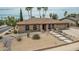 Single-story home boasts a manicured desert landscape with a concrete walkway and driveway at 4229 E Pearce Rd, Phoenix, AZ 85044