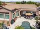 Aerial view of a home's backyard with a swimming pool, outdoor dining area, and built-in BBQ at 42293 W Good Vibrations Ln, Maricopa, AZ 85138