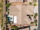 Private backyard oasis with covered patio, pool, and lush landscaping at 42293 W Good Vibrations Ln, Maricopa, AZ 85138