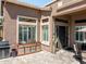 Backyard patio area with grill and access to the house at 42293 W Good Vibrations Ln, Maricopa, AZ 85138