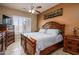 Bedroom featuring a wooden bed frame, neutral walls and tiled flooring at 42293 W Good Vibrations Ln, Maricopa, AZ 85138