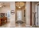 Elegant entryway showcasing a decorative tile floor, a round ceiling accent, and a white front door at 42293 W Good Vibrations Ln, Maricopa, AZ 85138