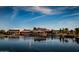 Beautiful community building and waterfront view with sailboats on a blue sky day at 42293 W Good Vibrations Ln, Maricopa, AZ 85138